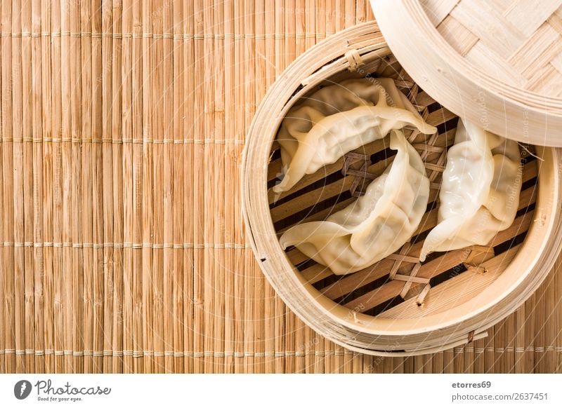 Dumplings or gyoza served in traditional steamer Japanese Chinese Oriental Food Healthy Eating Food photograph Tradition Soja-bean sprout Soy bean Meal Asians