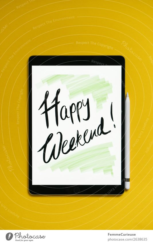 Tablet with a handwritten "Happy Weekend!" on yellow background Technology Entertainment electronics Advancement Future Creativity Have a nice weekend Desire