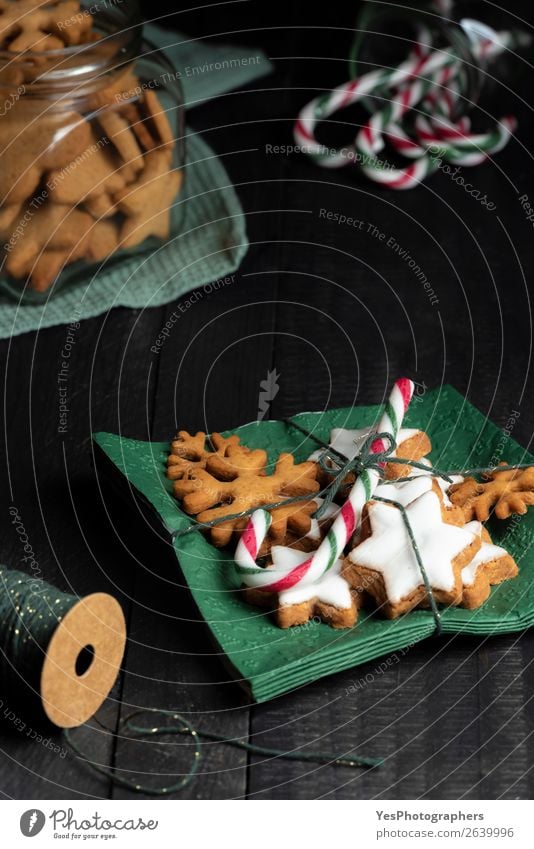 Gingerbread cookies and a candy cane on green napkins Cake Dessert Candy Decoration Kitchen Christmas & Advent Tradition Bakery candy canes christmassy