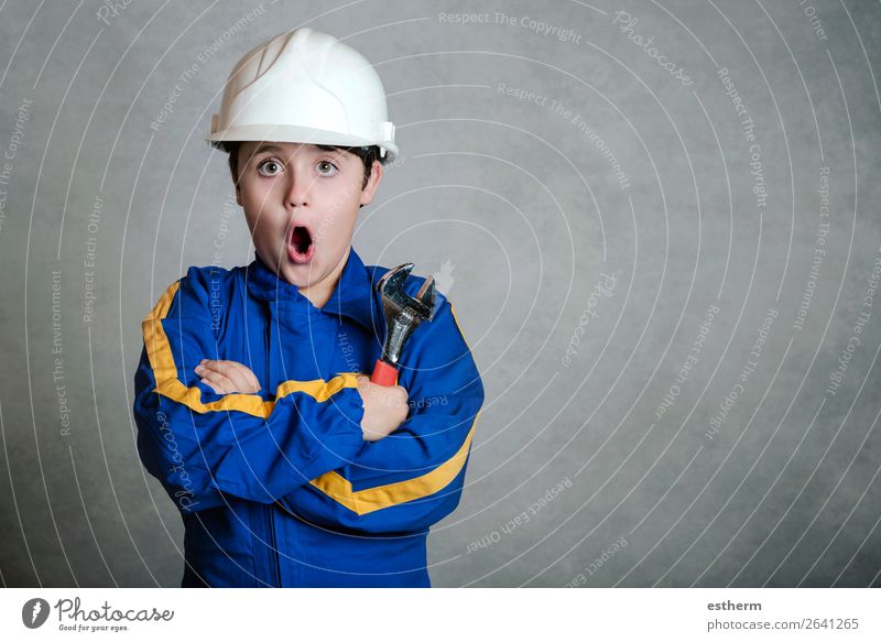 child in construction uniform Lifestyle Joy Child Work and employment Profession Construction site Tool Hammer Human being Masculine Boy (child) Infancy 1