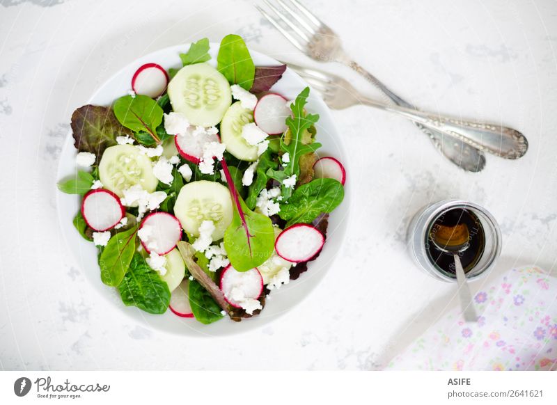 Mixed salad with baby leaves, radish, cucumber and feta cheese Cheese Vegetable Nutrition Lunch Dinner Vegetarian diet Diet Plate Bowl Fork Summer Baby Leaf