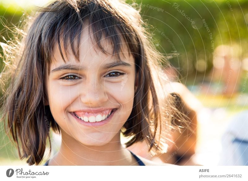 Portrait of a happy little girl smiling after swimming Lifestyle Joy Happy Beautiful Contentment Swimming pool Summer Garden Child Woman Adults Infancy Warmth