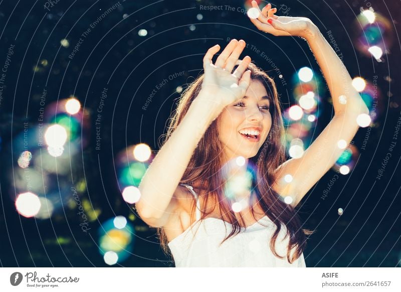Girl dancing with bubbles Joy Happy Beautiful Playing Summer Feasts & Celebrations Human being Woman Adults Nature Warmth Park Dream Happiness Soft Green Soap
