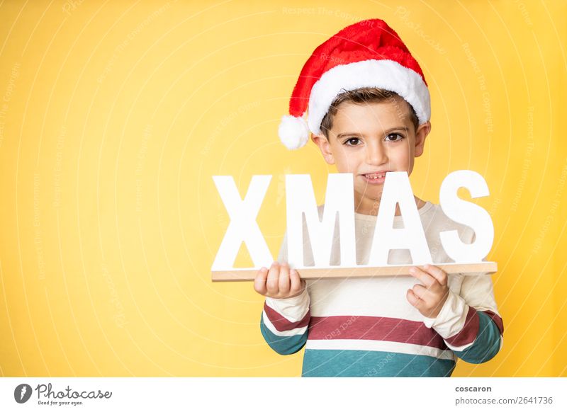 Adorable kid with Santa´s hat on Christmas day. Lifestyle Style Design Happy Winter Winter vacation Feasts & Celebrations Christmas & Advent Child Human being