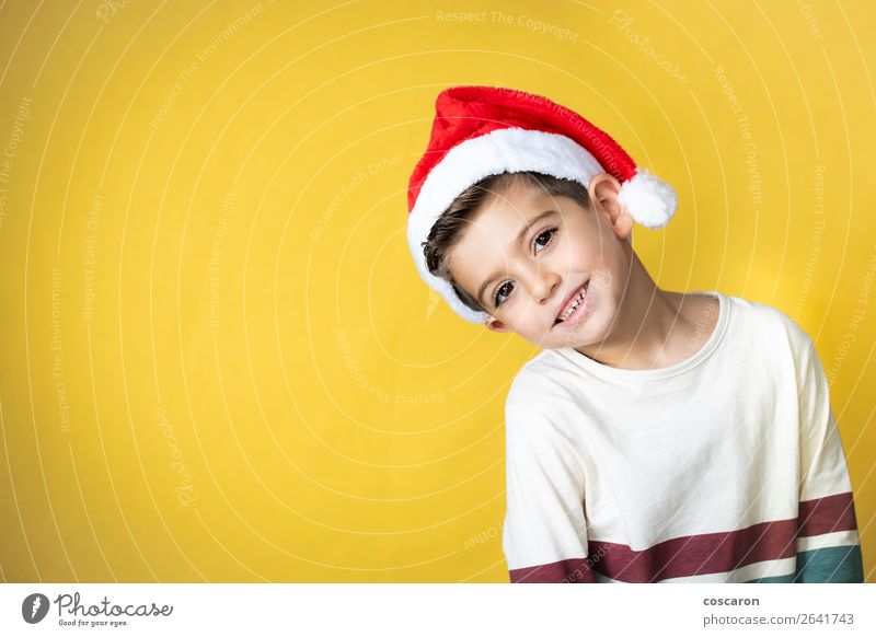 Adorable kid with Santa´s hat on Christmas day. Style Design Happy Winter Feasts & Celebrations Christmas & Advent New Year's Eve Child Human being Toddler