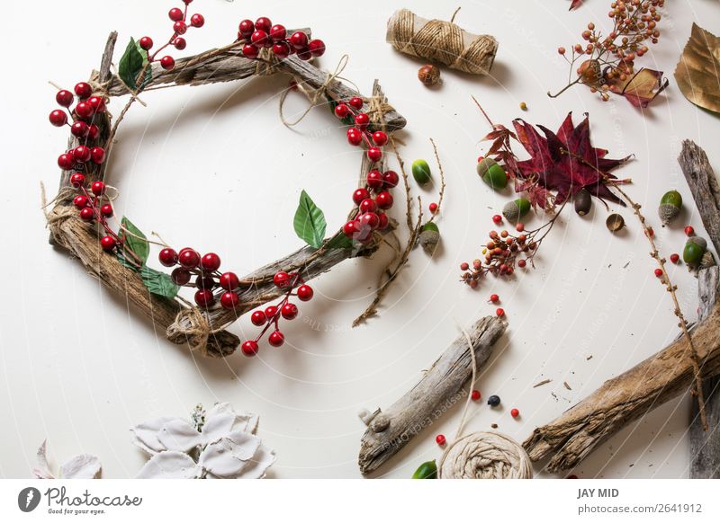 Creating a wooden wreath with christmas red barries Fruit Leisure and hobbies Winter Garden Decoration Thanksgiving Christmas & Advent New Year's Eve