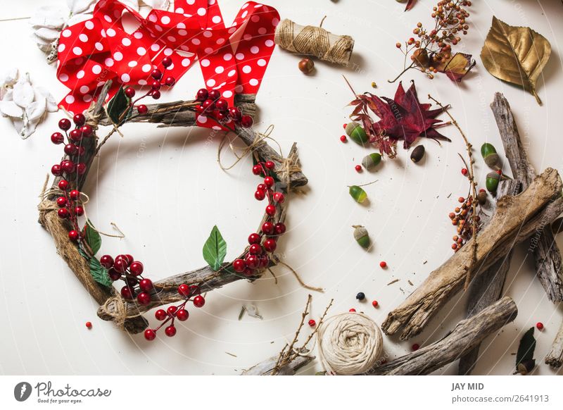 Creating a wooden wreath with christmas red barries Fruit Leisure and hobbies Winter Garden Decoration Thanksgiving Christmas & Advent New Year's Eve