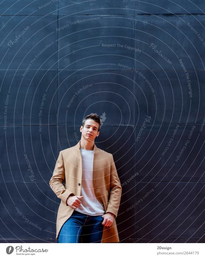 Young man wearing winter clothes standing in the street Lifestyle Elegant Style Beautiful Hair and hairstyles Winter Human being Man Adults Youth (Young adults)