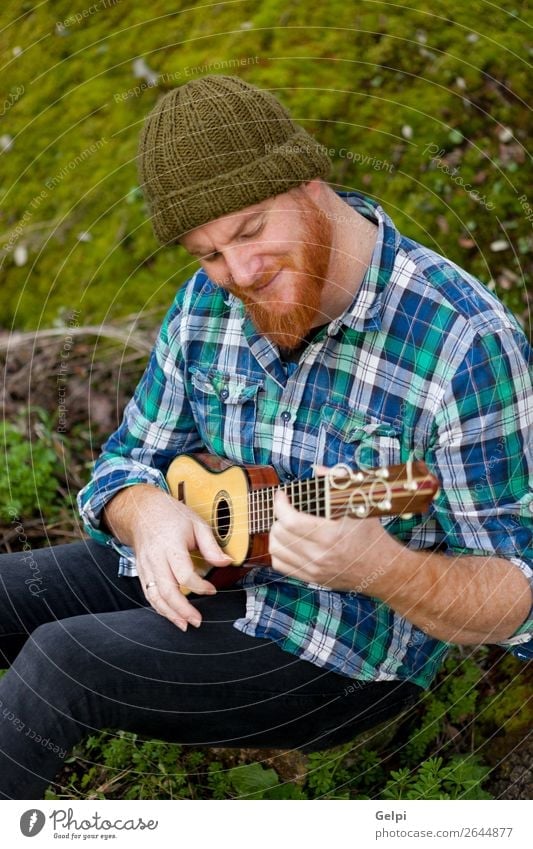 Hipster man with red beard playing a ukulele Leisure and hobbies Playing Entertainment Music Human being Man Adults Musician Nature Red-haired Moustache