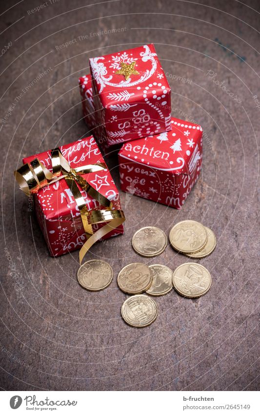 Christmas bonus Shopping Money Save Feasts & Celebrations Christmas & Advent Packaging Bow Solidarity Help Fairness Gift Donate Coin Poverty Joy Colour photo