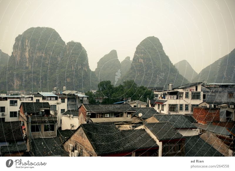 pick Nature Landscape Sky Clouds Horizon Hill Rock Mountain Peak karst mountains Yangshuo China Small Town Downtown Old town House (Residential Structure) Roof