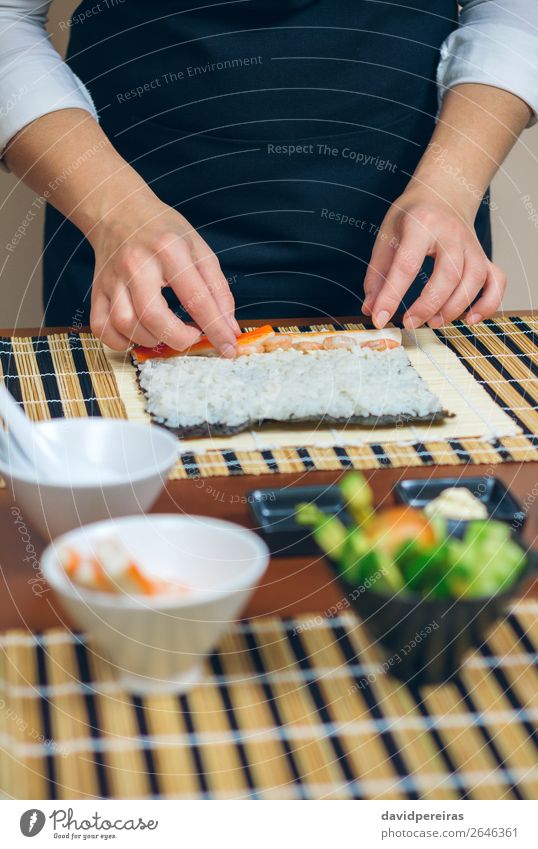 Chef hands placing ingredients on rice Seafood Diet Sushi Bowl Restaurant Human being Woman Adults Hand Make Fresh kitchener Putt crab stick prawn Rice maki