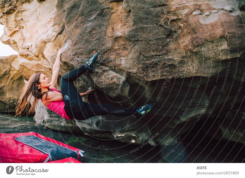 Brave young rock climber woman Joy Happy Beautiful Leisure and hobbies Adventure Ocean Mountain Hiking Sports Climbing Mountaineering Woman Adults Nature Rock