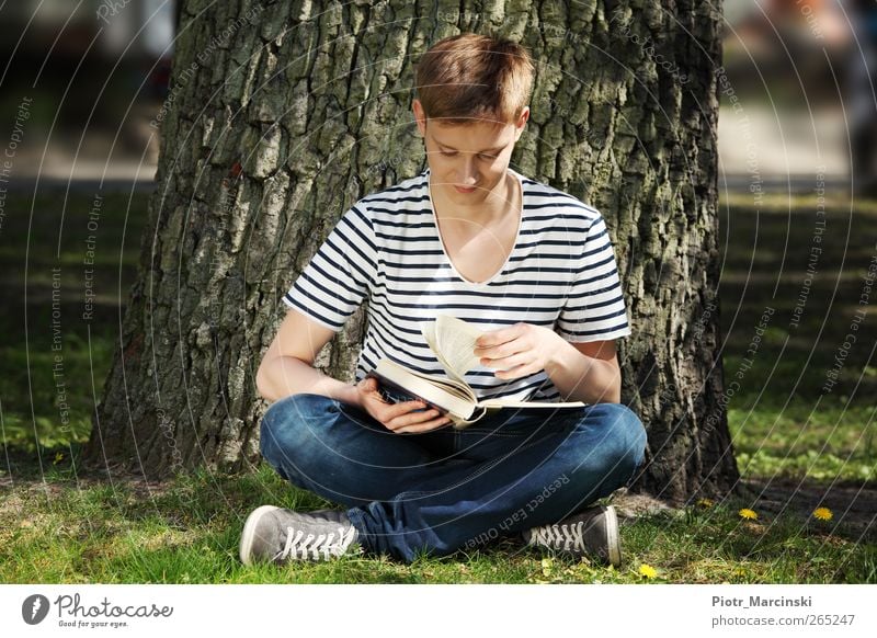 Teen boy reading a book Lifestyle Reading Summer Sun Garden Education Study University & College student Human being Young man Youth (Young adults) 1