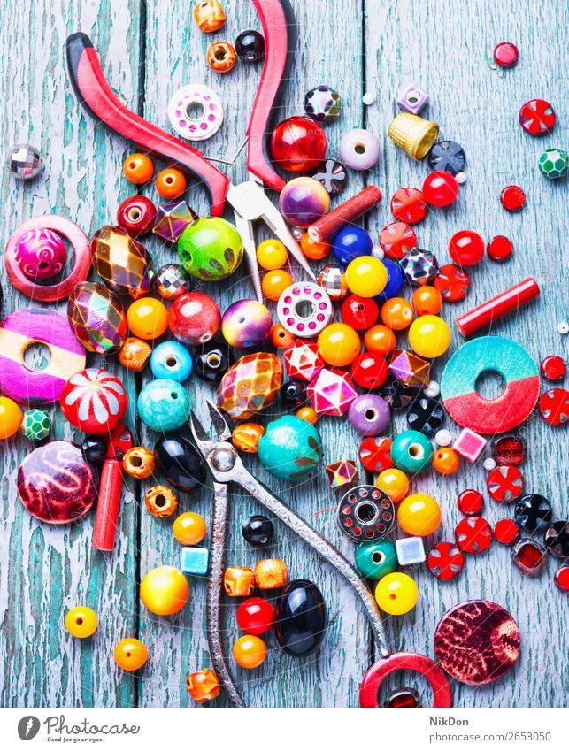 Making jewelry of beads - a Royalty Free Stock Photo from Photocase