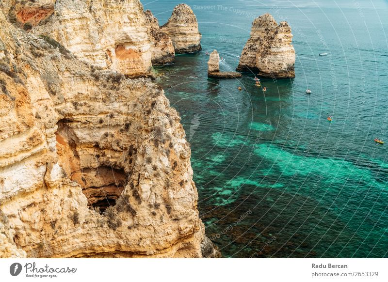 Rocks, Cliffs And Ocean Landscape At Lagos Bay Coast In Algarve, Portugal Nature Hole Cave Beach Stone Arch Window Vantage point Beautiful Vacation & Travel