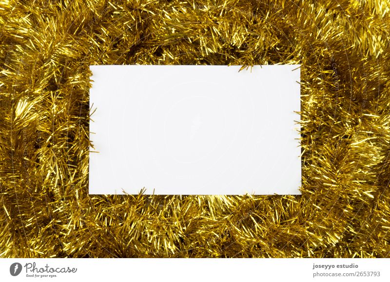 Christmas layout. White card on golden tinsel. Design Happy Winter Decoration Feasts & Celebrations New Year's Eve String Simple Above Gold Creativity