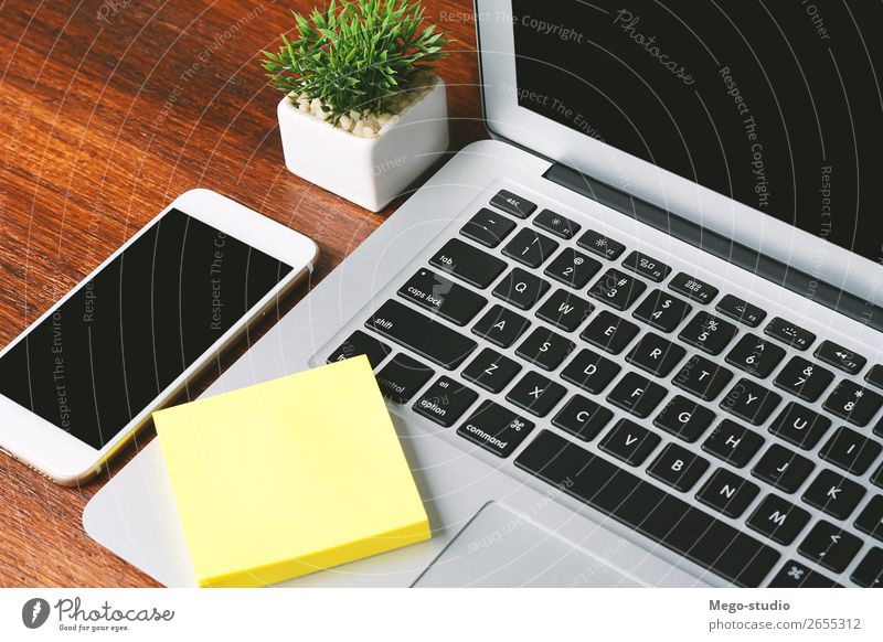 Laptop, Phone And Other Office Stuff On Table Stock Photo, Picture