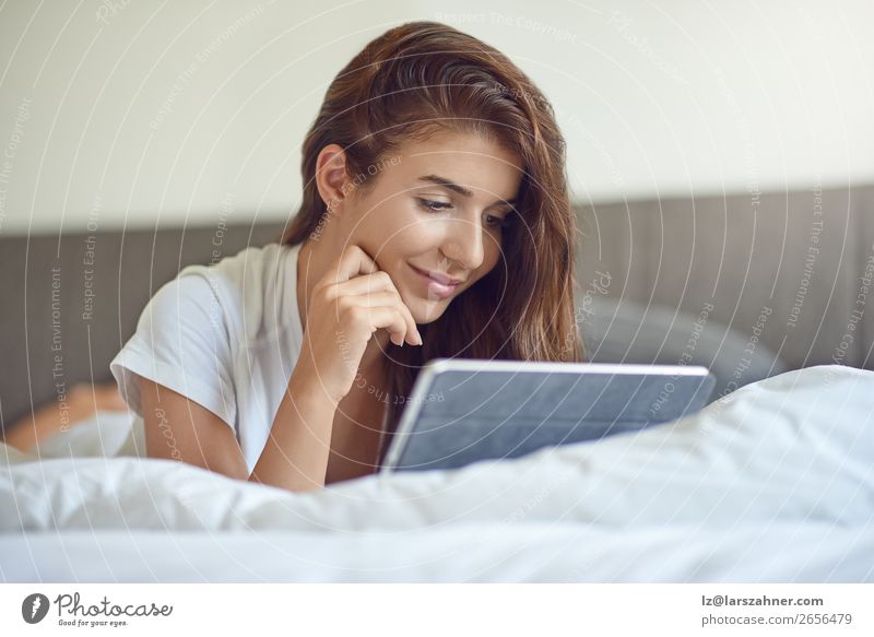 Pretty young woman with tablet in bed Shopping Happy Beautiful Bedroom Business Computer Technology Internet Woman Adults 1 Human being 18 - 30 years