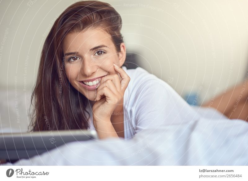 Pretty young woman with tablet in bed Shopping Happy Beautiful Bedroom Business Computer Technology Internet Woman Adults 1 Human being 18 - 30 years