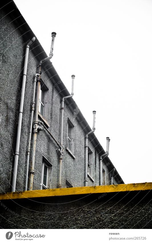 L Industrial plant Factory Manmade structures Building Architecture Wall (barrier) Wall (building) Facade Eaves Old Cold Broken Gloomy Town Yellow Dye Stripe