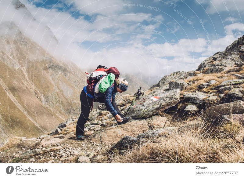 Young woman hiking | E5 Leisure and hobbies Vacation & Travel Adventure Hiking Youth (Young adults) Nature Landscape Clouds Autumn Beautiful weather Alps