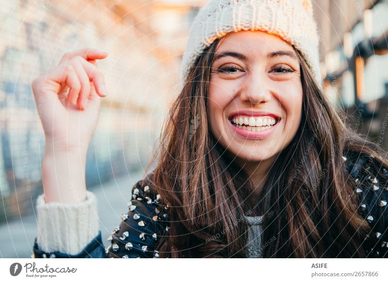 Laughing girl with woolen cap Joy Happy Beautiful Face Winter Human being Woman Adults Youth (Young adults) Autumn Warmth Fashion Brunette To enjoy Smiling