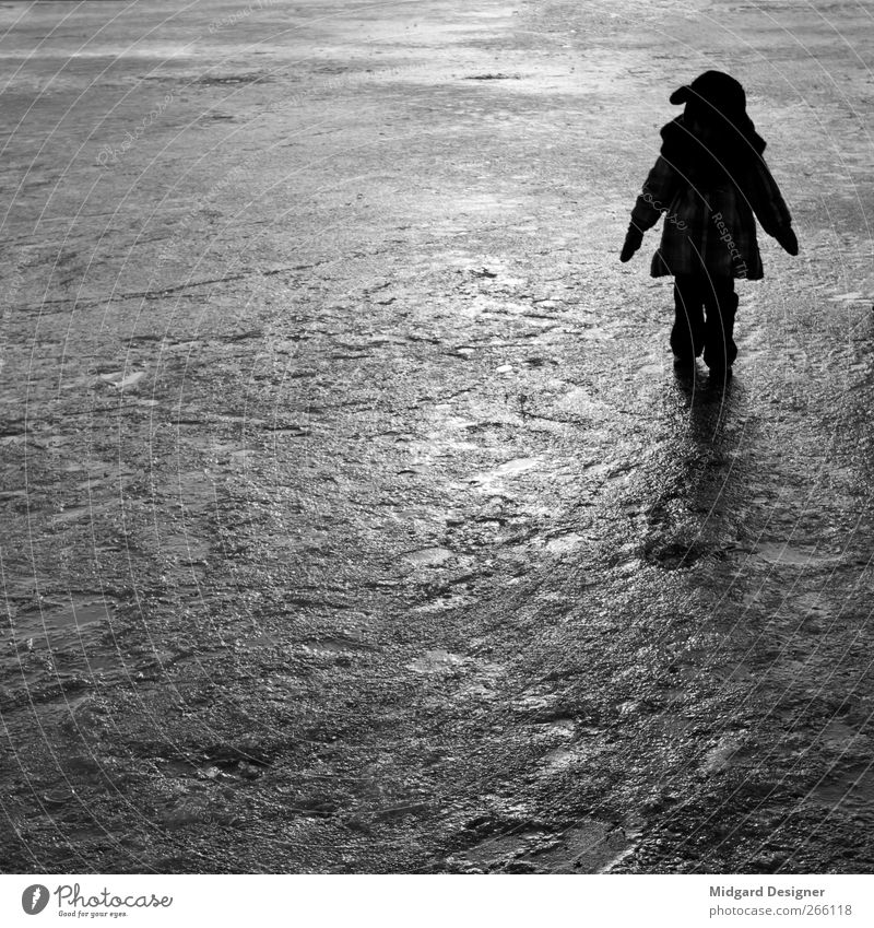 on one's own Human being Child Girl Infancy 1 3 - 8 years Winter Jacket Stand Cold Moody Ice Back-light Contrast Square Anonymous Silhouette Black & white photo