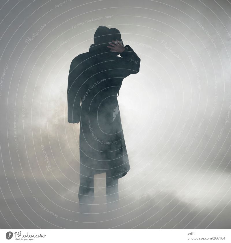 Woman wearing trench coat and standing in fog Exotic Human being Fog Coat Hat Smoke Observe Stand Wait Simple Anticipation Trust Serene Loneliness Mistrust