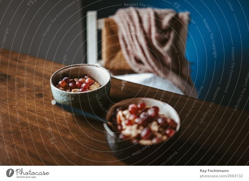 Two bowls with oat flakes, muesli and grapes Food Fruit Grain Oat flakes Bunch of grapes Breakfast Organic produce Vegetarian diet Bowl Spoon Lifestyle Style