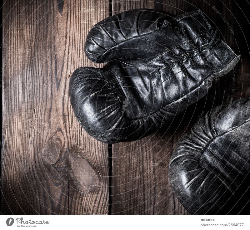 pair of old leather boxing gloves Fitness Sports Leather Gloves Wood Old Retro Brown Black Protection Competition Action Ancient Antique background boxer Boxing