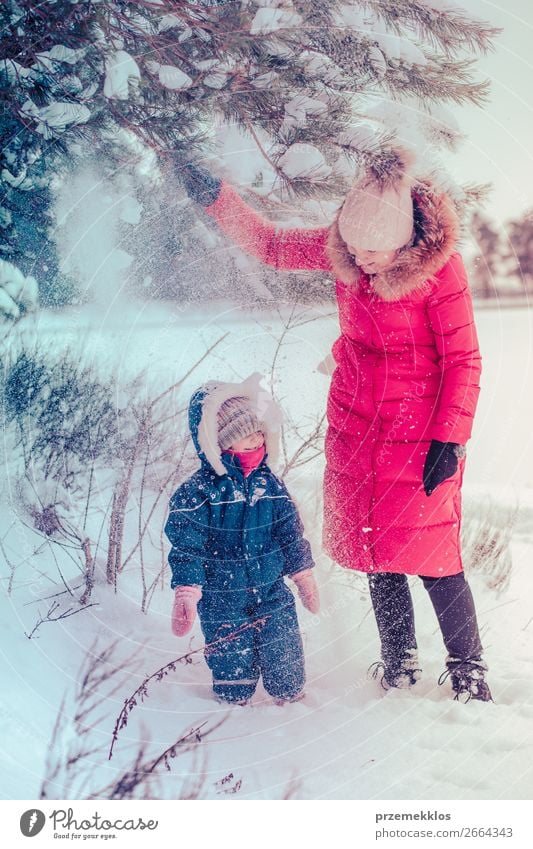 Mother and her little daughter enjoying winter Lifestyle Joy Happy Winter Snow Winter vacation Human being Child Toddler Girl Young woman Youth (Young adults)