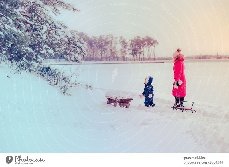 Mother and her daughter walking outdoors in winter Lifestyle Joy Happy Winter Snow Winter vacation Human being Child Toddler Girl Young woman