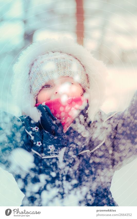 Little girl enjoying the snow on cold wintery day Lifestyle Joy Happy Winter Snow Winter vacation Child Toddler Girl Infancy 1 Human being 3 - 8 years Nature
