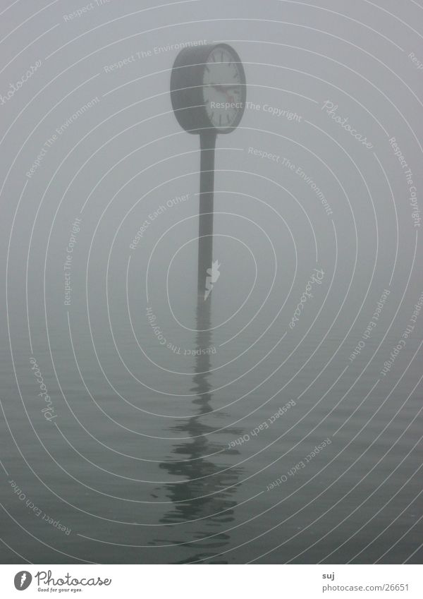 fog watch Fog Clock Station clock Lake Flood Gray Reflection Surface of water Obscure Water grumble World exposition