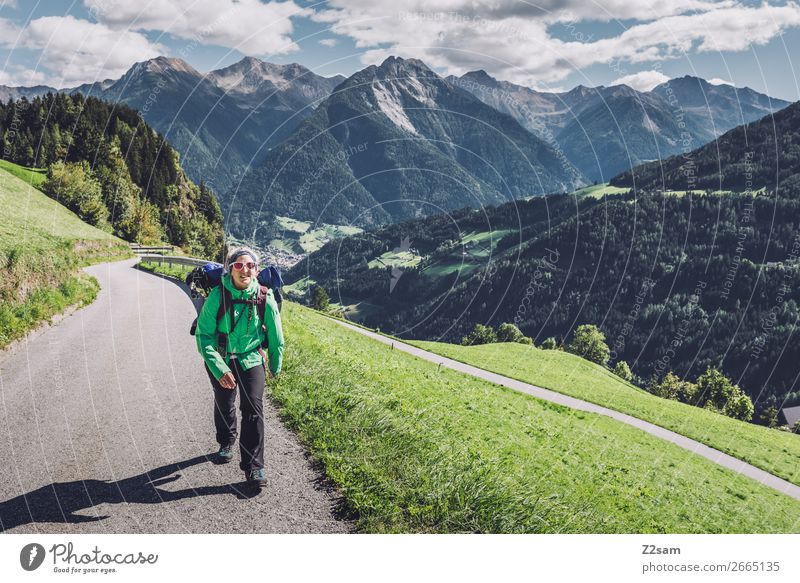Young woman crossing the Alps Vacation & Travel Mountain Hiking Climbing Mountaineering Youth (Young adults) 30 - 45 years Adults Nature Landscape Sky