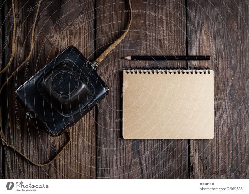 old vintage camera in a leather case Table Camera Technology Paper Wood Old Dark Retro Brown Black background equipment Photography Analog Antique Lens