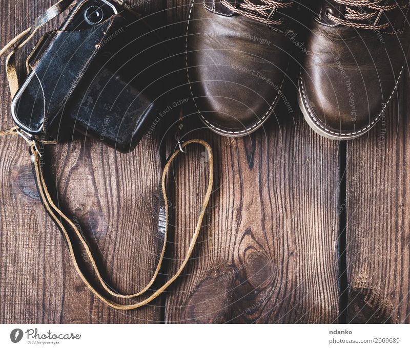 Leather Brown Shoes And An Old Vintage Camera A Royalty Free Stock Photo From Photocase