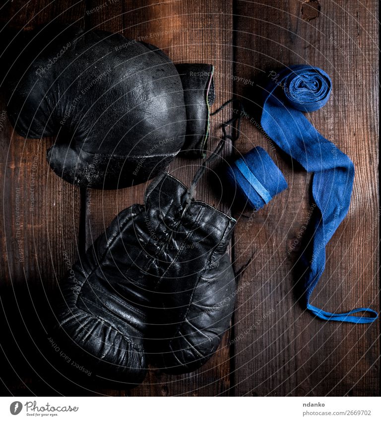 pair of very old black leather boxing gloves Lifestyle Fitness Sports Rope Leather Ring Gloves Wood Old Retro Blue Brown Black Protection Competition Might