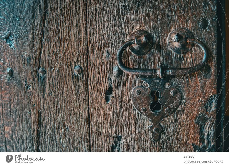 Detail of a lock and a handle of a medieval wooden door captured from the front Design Vacation & Travel Tourism House (Residential Structure) Decoration