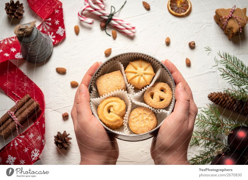 Woman holding cookies box above christmassy table Dessert Candy Winter Decoration Feasts & Celebrations Christmas & Advent New Year's Eve Delicious Sweet
