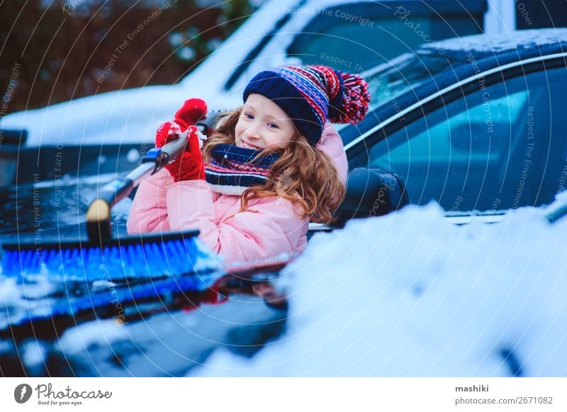 kid girl helping to clean car from snow Winter Snow Child Weather Bad weather Storm Snowfall Transport Street Vehicle Car Small Clean cold Frost Windscreen