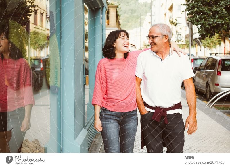 Father and daughter having fun together walking on the street Joy Happy Beautiful Woman Adults Man Parents Family & Relations Street Eyeglasses Smiling Laughter
