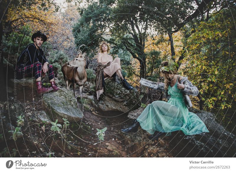 A Young group of friends Standing in the Woods and a Deer Lifestyle Elegant Beautiful Human being Masculine Feminine Androgynous Young woman
