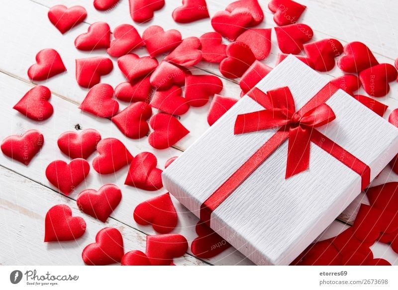 Red Hearts And Gift Box On White Wooden Background A Royalty Free Stock Photo From Photocase