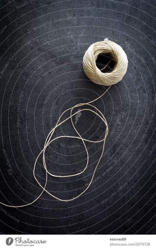 string hank on black background Rope String Ball Thin Roll Lace Spool Bind Circle direction Ecological fasten Knot Line linen Natural Nature reel Street Round