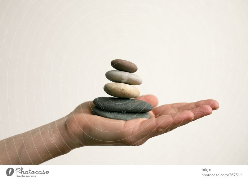 confidence man Harmonious Relaxation Calm Meditation Leisure and hobbies Playing Life Hand Pebble Stone Stack Tower To hold on Lie Tall Natural Round Emotions