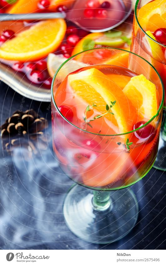 Steam sangria with fruits Christmas mulled wine alcohol punch drink wineglass orange smoke steam cranberries beverage juice cocktail fresh summer sweet lemon