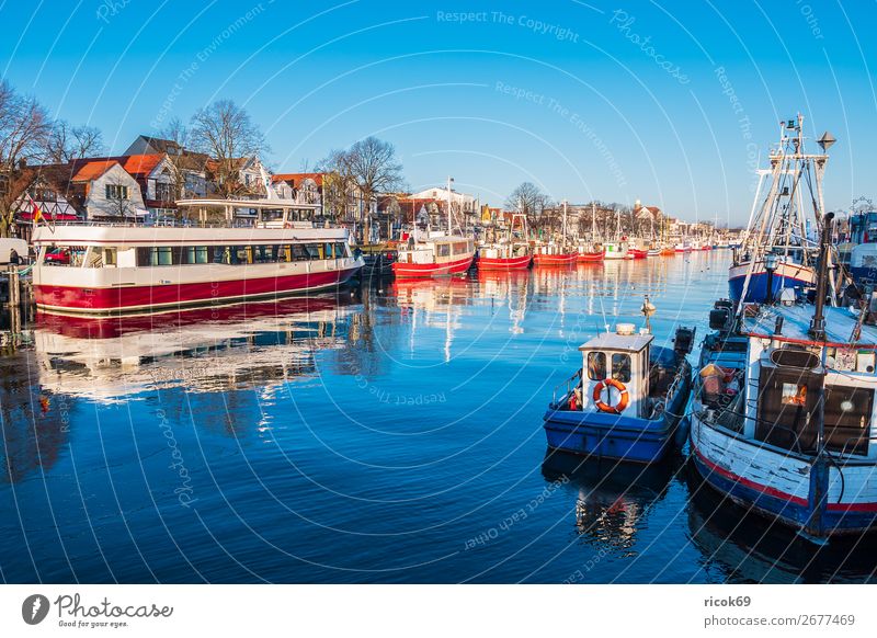 Fishing boats on the old river in Warnemünde Relaxation Vacation & Travel Tourism Ocean Winter Nature Landscape Water Cloudless sky Coast Architecture