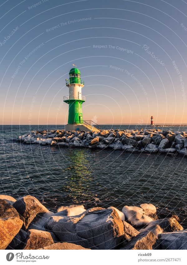 The pier in Warnemünde in winter Relaxation Vacation & Travel Tourism Ocean Winter Nature Landscape Water Clouds Coast Baltic Sea Tower Lighthouse Architecture
